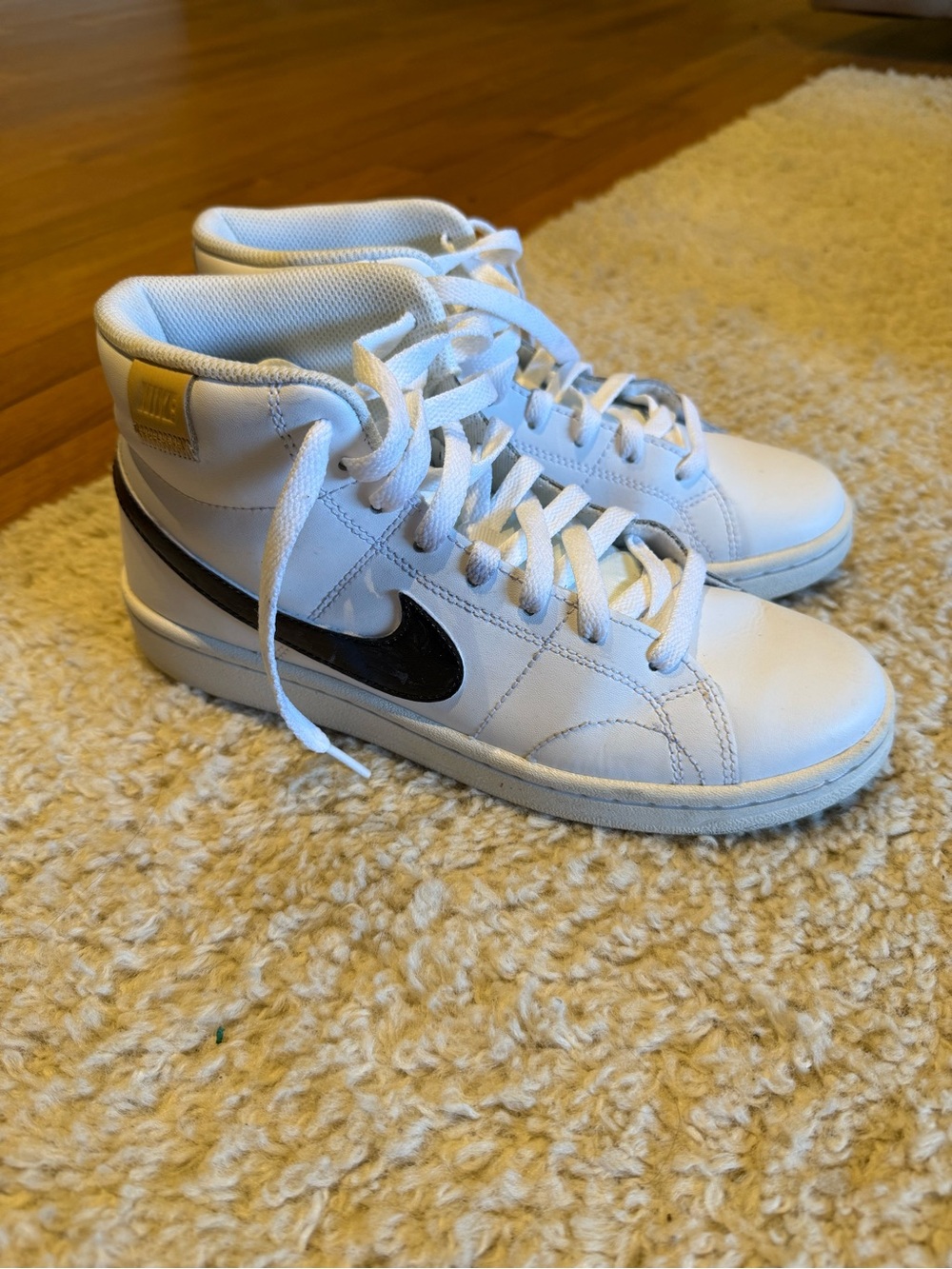 Nike White High-Top Sneakers with Black Swoosh and Tan Accent